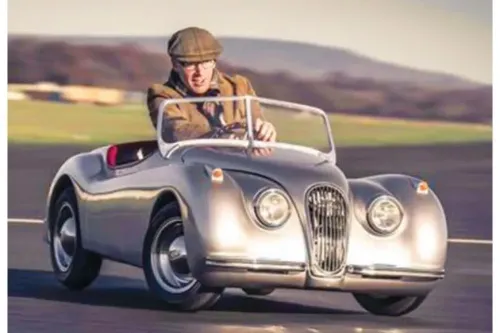 Adult’s jaguar xk120 mini roadster.